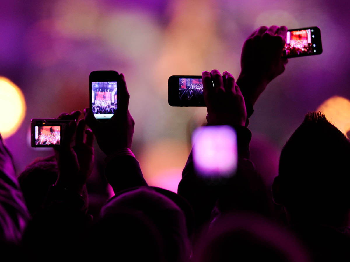 Venues are making fans seal their phones in lockable bags to stop them recording shows